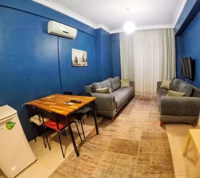 a living room with a table and a couch at Laluna Hotel Near Grand Bazaar City Center in Istanbul