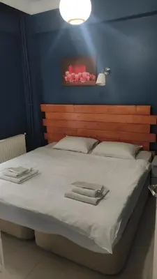a bedroom with a large bed with two towels on it at Laluna Hotel Near Grand Bazaar City Center in Istanbul