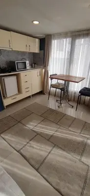 a kitchen with a table and a table and chairs at Laluna Hotel Near Grand Bazaar City Center in Istanbul