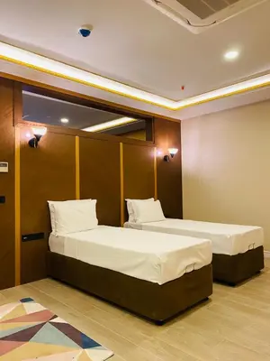 two beds in a hotel room with two bedsvisor at Ak residence in Istanbul