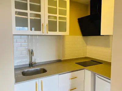 a kitchen with white cabinets and a sink at Ak residence in Istanbul