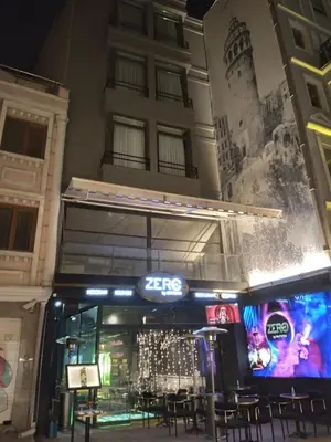 a restaurant with tables and chairs in front of a building at Mas Suites Karaköy in Istanbul