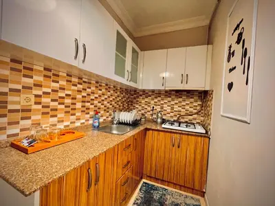 a kitchen with a sink and a counter top at Rio Suite Hotel in Istanbul