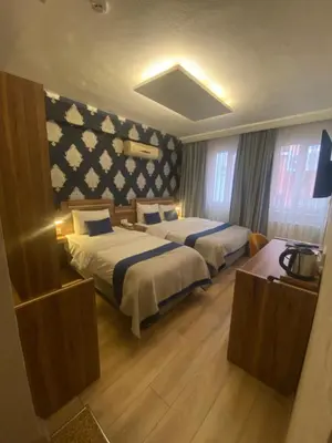 a hotel room with two beds in a room at ERA PALACE HOTEL B BLOK in Istanbul