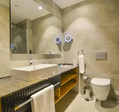 a bathroom with a sink and a toilet at SERENİTY COMFORT Hotel in Istanbul