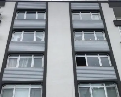 a tall building with four windows on the side of it at Luxury Z-Apart Family Homes 2 Bedrooms WIFI near Metro Zeytinburnu Istanbul in Istanbul