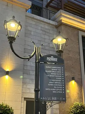 a street light with a sign in front of a building at Luxury Z-Apart Family Homes 2 Bedrooms WIFI near Metro Zeytinburnu Istanbul in Istanbul