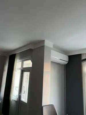 a room with a door and a chair and a window at Luxury Z-Apart Family Homes 2 Bedrooms WIFI near Metro Zeytinburnu Istanbul in Istanbul