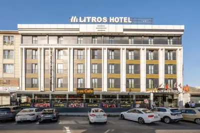 a large building with cars parked in front of it at Litros Hotel & Spa in Istanbul