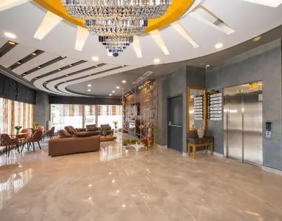 a large living room with a large chandelier at Seyithan Palace Spa Hotel in Istanbul