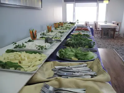 a long table with many plates of food on it at Şirin Hotel in Istanbul