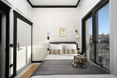 a bedroom with a bed and a large window at The Trinity Hotel Taksim - Special Category in Istanbul
