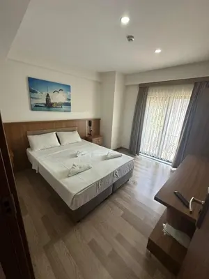 a bedroom with a large bed in a room at Hotel La SERA in Istanbul
