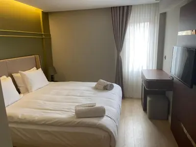 a hotel room with a bed and a television at The Biancho Hotel Old City - Special Category in Istanbul