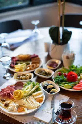 a table with many plates of food on it at Vela Verde Hotel & SPA in Yalova