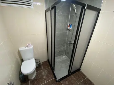 a shower stall with a toilet in a bathroom at Airport Best Hotel in Istanbul