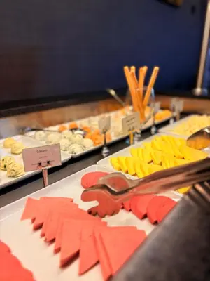 a buffet of food with cheese and other foods at Tekirdağ Yat Hotel in Tekirdag