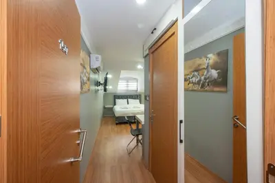 a hallway with a door leading to a bedroom at Taxim Sunpera Suites in Istanbul