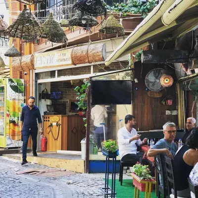 a group of people sitting outside of a restaurant at Antik Houses in Istanbul