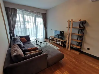 a living room with a couch and a tv at BENESTA BEYOGLU in Istanbul