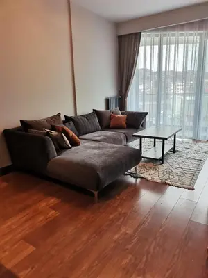 a living room with a couch and a table at BENESTA BEYOGLU in Istanbul