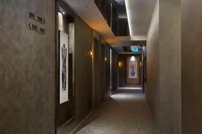 a corridor of a hallway with a long hallway at İzz Hotel Koşuyolu in Istanbul