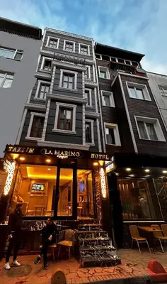 a building with a store in front of it at Taksim La Marino Hotel in Istanbul