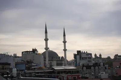a view of a city with two mosques at Taksim La Marino Hotel in Istanbul