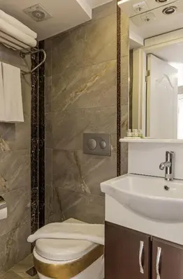 a bathroom with a toilet and a sink at Carvan HOTEL in Istanbul