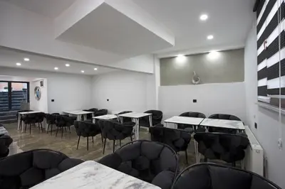 an empty room with tables and chairs in it at Carvan HOTEL in Istanbul