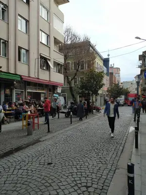 a man walking down a street in a city at Kalkedon Plus in Istanbul