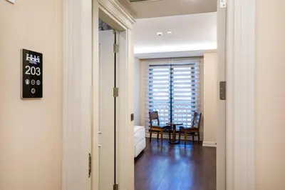 an open door to a room with a table and chairs at PRAG HOTEL in Istanbul