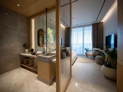 a bathroom with a sink and a living room at İnemare Hotel in Demirköy