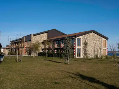 a large stone building with flags in front of it at İnemare Hotel in Demirköy