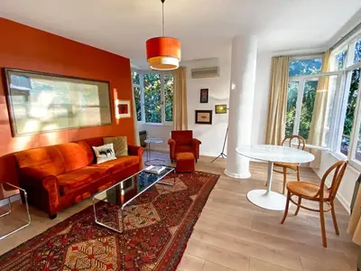 a living room with a couch and a table at Petek Pansiyon Fenerbahce Kadikoy in Istanbul