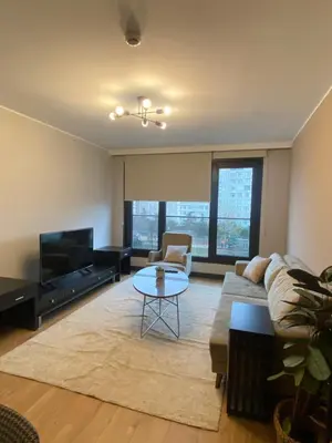 a living room with a couch and a table at Luxury Central Fully Equipped 2BR 2BA Apartment by Siena Suites in Istanbul