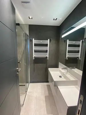 a bathroom with two sinks and a shower at Luxury Central Fully Equipped 2BR 2BA Apartment by Siena Suites in Istanbul