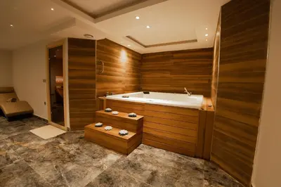 a large bathroom with a tub and a shower at Business Life Hotel & SPA Bakırköy in Istanbul