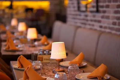 a table in a restaurant with a lamp on it at La Vida Old City Hotel in Istanbul