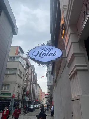 a sign on the side of a building on a street at Mina Life Hotel in Istanbul