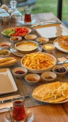 a table with many plates of food on it at Kartepe Panorama in Kartepe