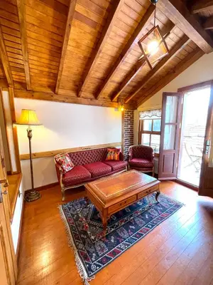 a living room with a couch and a coffee table at Authentic Turkish Home Suite in Istanbul