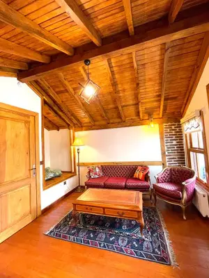 a living room with a couch and a coffee table at Authentic Turkish Home Suite in Istanbul