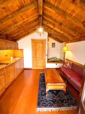 a living room with a red couch and a table at Authentic Turkish Home Suite in Istanbul