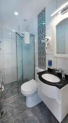 a bathroom with a toilet and a sink and a shower at Lika Hotel - Standard Double or Twin Room in Istanbul