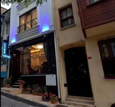 a store front of a building with a black door at Lika Hotel - Eco Double Room - Center Istanbul in Istanbul