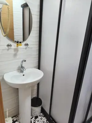 a bathroom with a sink and a mirror at Reydel Hotel in Istanbul