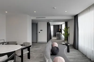 a living room with a couch and a table at Pera Bosphorus Hotel in Istanbul