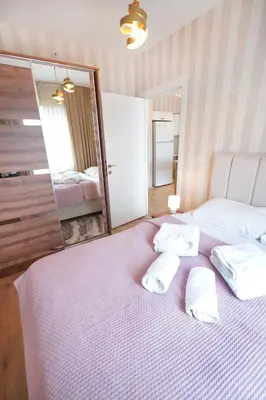 a bedroom with a bed with two pillows on it at Classic Suite SS5 in Istanbul