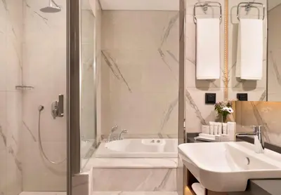 a bathroom with a tub and a sink and a shower at Royan Hotel Hagia Sophia, a member of Radisson Individuals in Istanbul